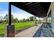 Inviting outdoor patio with covered seating, perfect for enjoying the serene backyard ambiance at 10106 W 69Th Pl, Arvada, CO 80004
