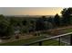 Breathtaking sunset views from the lush backyard create a serene and picturesque setting at 10106 W 69Th Pl, Arvada, CO 80004