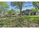 Beautiful backyard featuring lush lawn and mature trees at 11510 Lewistown St, Commerce City, CO 80022