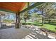Landscaped backyard with a covered patio overlooking the large yard and distant view at 11510 Lewistown St, Commerce City, CO 80022