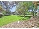 Expansive backyard with verdant lawn and mature trees at 11510 Lewistown St, Commerce City, CO 80022