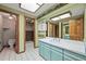 Bathroom featuring a vanity with sink, and a tiled shower at 11510 Lewistown St, Commerce City, CO 80022