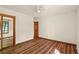 Spacious bedroom with wood floors, ceiling fan and mirrored closet doors at 11510 Lewistown St, Commerce City, CO 80022