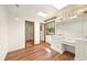 Bright bedroom with wood floors, vanity, and skylights at 11510 Lewistown St, Commerce City, CO 80022