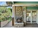 Outdoor deck area featuring a stone fireplace and access to the home at 11510 Lewistown St, Commerce City, CO 80022
