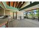 Outdoor deck area featuring an outdoor kitchen and grill at 11510 Lewistown St, Commerce City, CO 80022