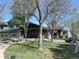 Beautiful home with a well-manicured lawn and mature trees, showcasing its inviting curb appeal at 11510 Lewistown St, Commerce City, CO 80022