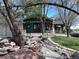 Charming exterior featuring stone accents, unique architecture, and mature trees in a peaceful setting at 11510 Lewistown St, Commerce City, CO 80022