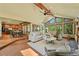 Open-concept living room with vaulted ceilings, many windows and an adjacent kitchen at 11510 Lewistown St, Commerce City, CO 80022