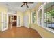 Bright living room with warm yellow walls and a partial view of the kitchen with an open doorway at 11510 Lewistown St, Commerce City, CO 80022