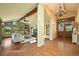 Open living space with wood floors, fireplace, and a view to the entryway at 11510 Lewistown St, Commerce City, CO 80022
