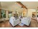 Cozy living room featuring a fireplace, hardwood floors and natural lighting at 11510 Lewistown St, Commerce City, CO 80022