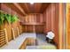 Inviting sauna featuring wood paneling, built-in seating, and a unique design at 11510 Lewistown St, Commerce City, CO 80022