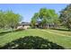 Expansive yard featuring lush greenery, mature trees, and landscaping at 11510 Lewistown St, Commerce City, CO 80022