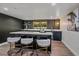 Stylish home bar featuring sleek countertops, modern barstools, and an elegant backsplash at 805 Elm St, Denver, CO 80220