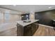 Finished basement featuring a stylish island, modern lighting, and a partially finished living area at 805 Elm St, Denver, CO 80220
