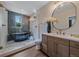 Modern bathroom featuring a glass shower with dual showerheads, a unique soaking tub, and a vanity at 805 Elm St, Denver, CO 80220