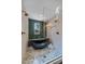 Modern bathroom featuring a glass shower with dual showerheads and a unique soaking tub with green tile at 805 Elm St, Denver, CO 80220