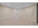 Bright, neutral bedroom featuring plush carpeting, recessed lighting and trim work at 805 Elm St, Denver, CO 80220