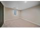Neutral bedroom showcasing plush carpeting, natural light and a modern feel at 805 Elm St, Denver, CO 80220