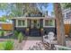Charming renovated bungalow with a welcoming front porch and dark brick accents, ready for relaxing in this vibrant neighborhood at 805 Elm St, Denver, CO 80220