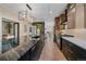 Spacious kitchen with a marble island, stainless steel appliances, and pendant lighting, seamlessly connecting to the dining area at 805 Elm St, Denver, CO 80220
