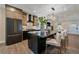Bright, open kitchen with an island, modern appliances, and view into the living area, great for entertaining and Gathering gatherings at 805 Elm St, Denver, CO 80220