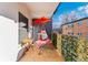 Relaxing balcony featuring a chair swing, side table, and privacy screen at 1265 Race St # 203, Denver, CO 80206