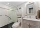 Modern bathroom features a glass-enclosed shower, stylish vanity, and updated fixtures at 1265 Race St # 203, Denver, CO 80206