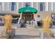 Condo entrance with awning, stone planters, and a well-maintained walkway at 1265 Race St # 203, Denver, CO 80206
