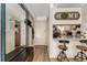 Apartment entry with breakfast bar and wood flooring, showcasing a cozy atmosphere at 1265 Race St # 203, Denver, CO 80206