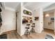 Charming kitchenette with breakfast bar, bar stools, and wood-look flooring at 1265 Race St # 203, Denver, CO 80206