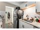 Functional kitchenette featuring a stainless steel refrigerator and granite countertops at 1265 Race St # 203, Denver, CO 80206