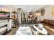 Inviting living area boasts a fireplace, stylish decor, and an open layout to the dining space at 1265 Race St # 203, Denver, CO 80206