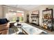 Bright living room boasts a stone fireplace, sliding glass doors, and modern decor at 1265 Race St # 203, Denver, CO 80206