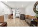 Inviting condo lobby with tile floors, comfortable seating, and a decorative mirror at 1265 Race St # 203, Denver, CO 80206