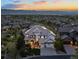 Expansive home featuring mountain views, neutral colors, and professional landscaping at 10525 Sunshower Pl, Highlands Ranch, CO 80126