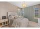Comfortable bedroom with paneled walls and neutral decor, offering a serene retreat at 10525 Sunshower Pl, Highlands Ranch, CO 80126