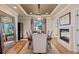Elegant dining room with hardwood floors, fireplace, and a stylish chandelier at 10525 Sunshower Pl, Highlands Ranch, CO 80126