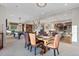 Spacious room with a dining area, pool table, wooden floors, and access to the kitchen at 10525 Sunshower Pl, Highlands Ranch, CO 80126