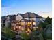 Back of the home with multiple decks and patios, perfect for outdoor entertaining at 10525 Sunshower Pl, Highlands Ranch, CO 80126
