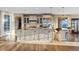 Beautiful kitchen island with pendant lighting, stainless steel appliances, and hardwood floors at 10525 Sunshower Pl, Highlands Ranch, CO 80126