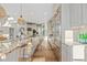 Modern kitchen with granite island, stainless steel appliances, and hardwood floors at 10525 Sunshower Pl, Highlands Ranch, CO 80126
