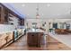 Gourmet kitchen featuring marble countertops, stainless steel appliances, and a center island at 10525 Sunshower Pl, Highlands Ranch, CO 80126