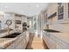 Modern kitchen with a granite island, stainless steel appliances, and custom cabinetry at 10525 Sunshower Pl, Highlands Ranch, CO 80126