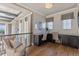 Bright loft area with custom dual vanities, wood floors, and large windows offering beautiful views at 10525 Sunshower Pl, Highlands Ranch, CO 80126