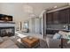 Enjoy the spacious loft with a cozy fireplace, wet bar, and built-in cabinets at 10525 Sunshower Pl, Highlands Ranch, CO 80126