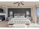 Beautiful main bedroom featuring a fireplace, accent wall, recessed lighting, and balcony access at 10525 Sunshower Pl, Highlands Ranch, CO 80126