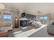 This bright, spacious main bedroom has a fireplace, and a private balcony with scenic mountain views at 10525 Sunshower Pl, Highlands Ranch, CO 80126