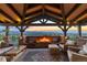 Relax on the covered patio with a fireplace and enjoy panoramic sunset views from this outdoor oasis at 10525 Sunshower Pl, Highlands Ranch, CO 80126